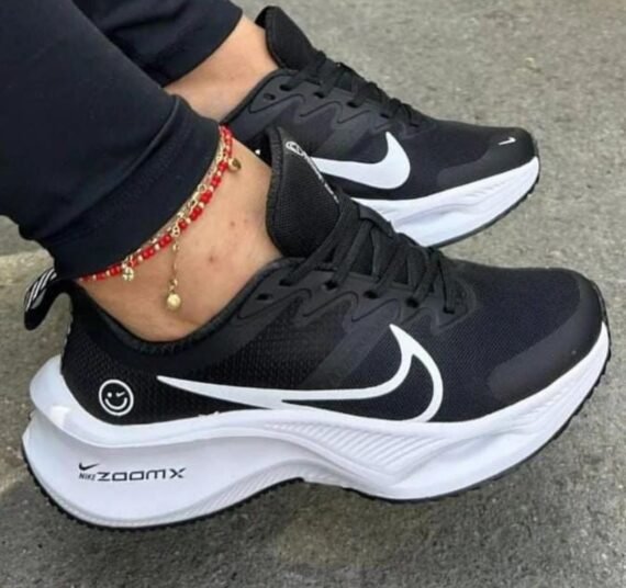 Push your limits in style with the Nike ZoomX Black Sneaker featuring a bold white swoosh and cutting-edge performance.