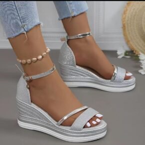 Shine bright in these glitter ankle strap wedge sandals – glam, height, and comfort in one chic pair.