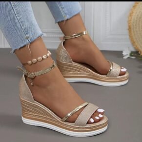 Shine bright in these glitter ankle strap wedge sandals – glam, height, and comfort in one chic pair.