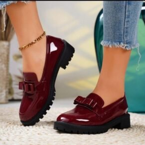 Step into timeless elegance with our Women's Patent Leather Loafers. Crafted from high-shine patent leather, these loafers feature a classic silhouette with a modern twist, offering a luxurious finish that instantly elevates your look. The slip-on design ensures effortless wear, while the cushioned insole and sturdy sole provide lasting comfort for all-day use. Perfect for the office, weekend brunch, or a chic casual ensemble, these loafers blend classic charm with contemporary polish for a truly versatile footwear essential.