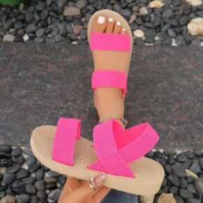Brighten up your warm-weather wardrobe with our Pink Elastic Strap Sandals. Designed for both comfort and convenience, these sandals feature stretchy elastic straps that provide a secure yet flexible fit, adapting to your foot for all-day ease. The vibrant pink color adds a fun pop to any outfit, while the cushioned sole ensures lightweight support with every step. Whether you're heading to the beach, strolling through the city, or running errands, these sandals are the ideal blend of casual charm and practical comfort.