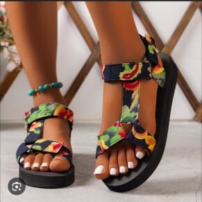 Add a playful touch to your warm-weather look with our Floral Platform Velcro Sandals. Designed with vibrant floral patterns and a chunky platform sole, these sandals bring a burst of personality to every step. The easy-to-use Velcro straps ensure a secure, adjustable fit, while the cushioned footbed offers comfort and support for all-day wear. Whether you're heading to a beach party, a casual day out, or a festival, these sandals combine style, function, and fun in one eye-catching package.