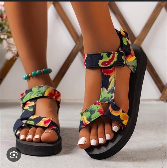 Add a playful touch to your warm-weather look with our Floral Platform Velcro Sandals. Designed with vibrant floral patterns and a chunky platform sole, these sandals bring a burst of personality to every step. The easy-to-use Velcro straps ensure a secure, adjustable fit, while the cushioned footbed offers comfort and support for all-day wear. Whether you're heading to a beach party, a casual day out, or a festival, these sandals combine style, function, and fun in one eye-catching package.