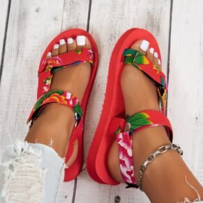 Add a playful touch to your warm-weather look with our Floral Platform Velcro Sandals. Designed with vibrant floral patterns and a chunky platform sole, these sandals bring a burst of personality to every step. The easy-to-use Velcro straps ensure a secure, adjustable fit, while the cushioned footbed offers comfort and support for all-day wear. Whether you're heading to a beach party, a casual day out, or a festival, these sandals combine style, function, and fun in one eye-catching package.