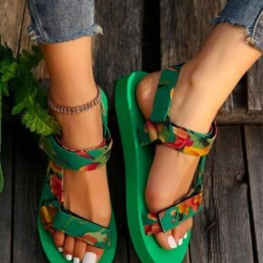 Add a playful touch to your warm-weather look with our Floral Platform Velcro Sandals. Designed with vibrant floral patterns and a chunky platform sole, these sandals bring a burst of personality to every step. The easy-to-use Velcro straps ensure a secure, adjustable fit, while the cushioned footbed offers comfort and support for all-day wear. Whether you're heading to a beach party, a casual day out, or a festival, these sandals combine style, function, and fun in one eye-catching package.