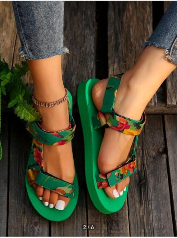 Add a playful touch to your warm-weather look with our Floral Platform Velcro Sandals. Designed with vibrant floral patterns and a chunky platform sole, these sandals bring a burst of personality to every step. The easy-to-use Velcro straps ensure a secure, adjustable fit, while the cushioned footbed offers comfort and support for all-day wear. Whether you're heading to a beach party, a casual day out, or a festival, these sandals combine style, function, and fun in one eye-catching package.