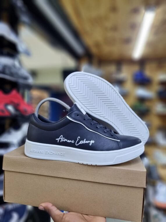 Step into contemporary style with Armani Exchange Sneakers — where streetwear-inspired design meets upscale detailing. Crafted with precision and comfort in mind, these sneakers feature a streamlined silhouette, breathable materials, and a cushioned sole for all-day wear. Branded with the iconic A|X logo, they bring a bold yet minimalist aesthetic that pairs effortlessly with jeans, joggers, or smart-casual looks. Whether you're heading to the city or keeping it casual, Armani Exchange Sneakers deliver the perfect mix of fashion and function.