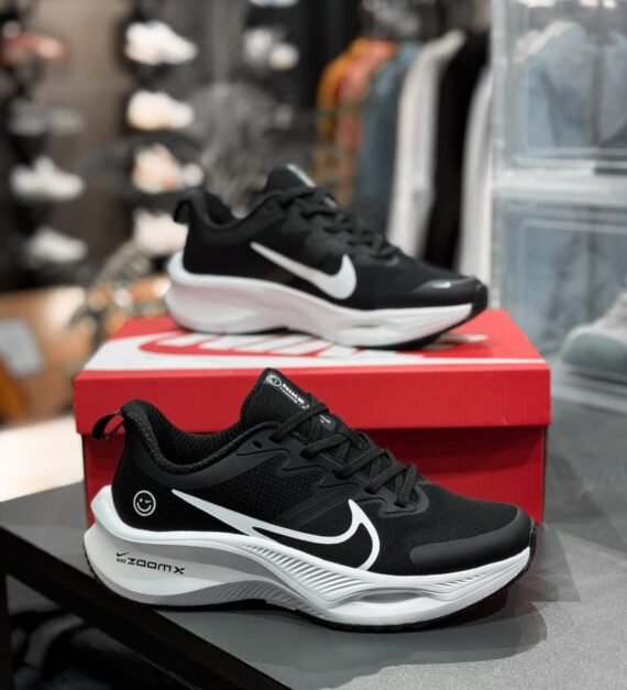 Step into comfort and fun with the Nike ZoomX Smiley Sneaker! Featuring a playful smiley face design and ultra-responsive ZoomX cushioning, these sneakers deliver lightweight energy return for all-day wear.