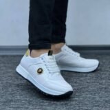 Step into bold luxury with the Versace Gold Crest Sneakers—featuring a striking gold finish, iconic Medusa crest accents, and a sleek, modern silhouette built for comfort and statement style.