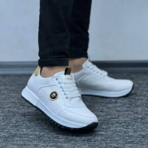 Step into bold luxury with the Versace Gold Crest Sneakers—featuring a striking gold finish, iconic Medusa crest accents, and a sleek, modern silhouette built for comfort and statement style.
