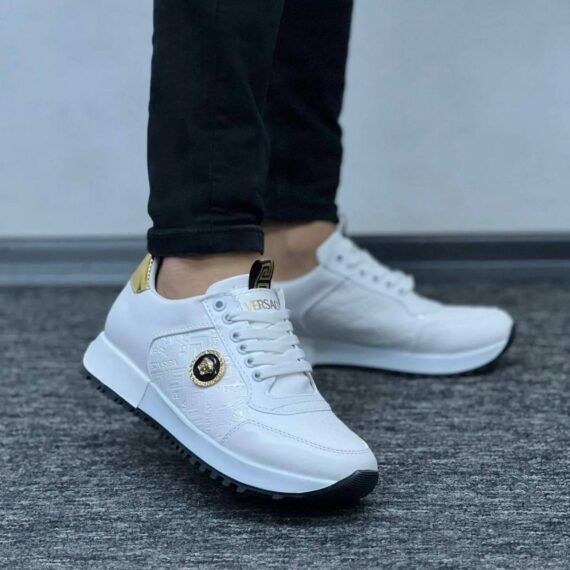Step into bold luxury with the Versace Gold Crest Sneakers—featuring a striking gold finish, iconic Medusa crest accents, and a sleek, modern silhouette built for comfort and statement style.