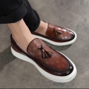 Elevate your ensemble with the Brown VersaTassel Loafer—featuring a rich brown hue, premium leather construction, and a sleek silhouette that complements both formal and casual outfits.
