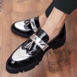 Elegant and stylish men's dress shoes, perfect for business or formal occasions, featuring a classic tassel design and shiny leather finish.