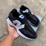 The New Balance 327 reinvents '70s running heritage with bold, modern flair—featuring a flared midsole, oversized "N" branding, and a trail-inspired lug outsole for standout everyday style.