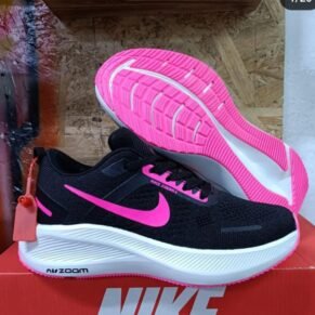 Sneakers in a black mesh upper with pink accents, perfect for any outfit. Available in various sizes and styles.