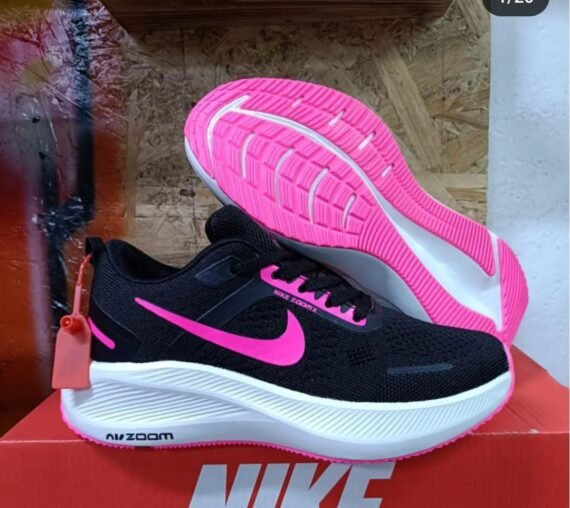 Sneakers in a black mesh upper with pink accents, perfect for any outfit. Available in various sizes and styles.